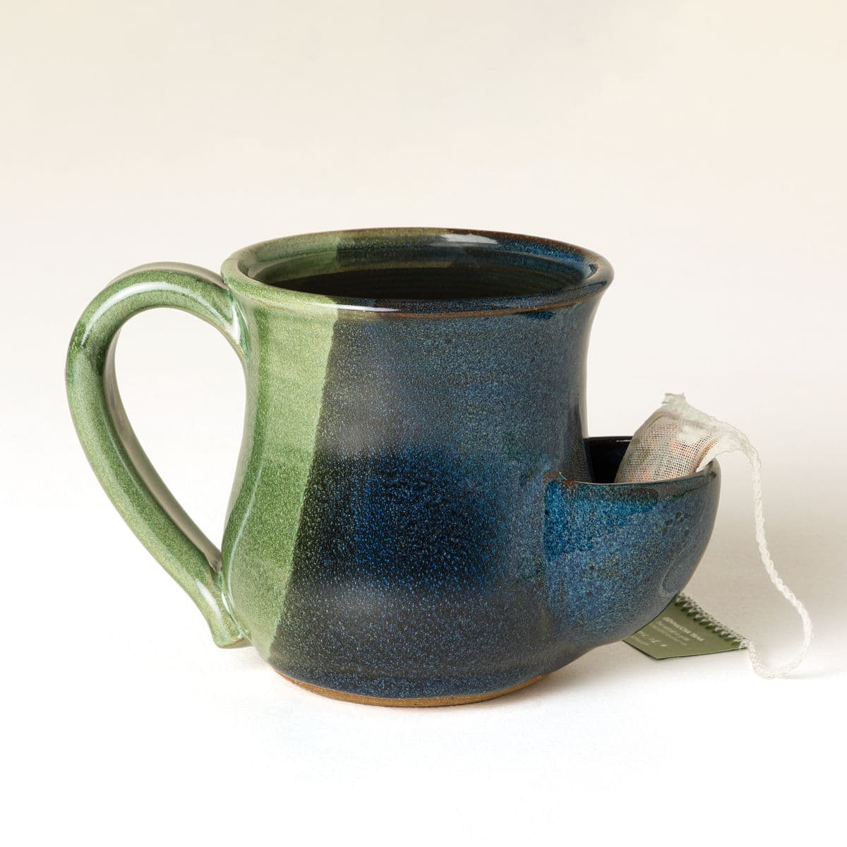 Uncommon Goods | Tea Bag Pocket Mug | stoneware mug, tea bag holder